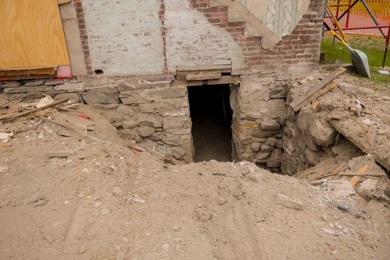 This opening in the north elevation foundation wall used to provide access to the basement from the more modern addition. Masons will begin 